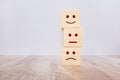 Wooden cube block stacking with icon face, The best excellent business services rating customer experience Royalty Free Stock Photo