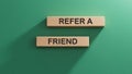 wooden cube block with word friend, refer. Investment and save money concept. Wooden cube blocks. Copy space