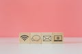 Wooden cube blocks with icon wifi dialogue box letter and laptop, contact message.