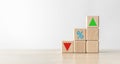 Wooden cube blocks with sign percentage symbol and arrow up and down direction.