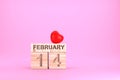 Wooden cube calendar with 14th february date and red heart, Valentime`s day concept Royalty Free Stock Photo