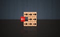 Wooden cube difference concept. One red wood Block with unique direction, individuality and group, leader and leadership business Royalty Free Stock Photo