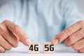 Wooden cube handle to turn 4G into 5G  5th Generation, technology turns the transition to high speed and the Internet of things Royalty Free Stock Photo