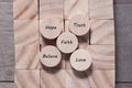 Wooden cube with inspirational text Faith, trust, believe, hope and love. Beautiful wooden table background. Business and Faith Royalty Free Stock Photo