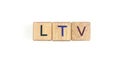 Wooden cube with the letter from the ltv word . wooden cubes