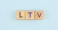Wooden cube with the letter from the ltv word . wooden cubes