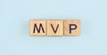 Wooden cube with the letter from the mvp word . wooden cubes