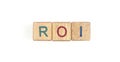 Wooden cube with the letter from the roi word . wooden cubes
