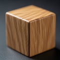 A wooden cube with a smooth polished surface and visible grain patterns is Royalty Free Stock Photo