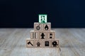 Wooden cube Stacked in Pyramid shape with Fire and safety icons.