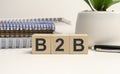 wooden cube on a white table with text B2B. concept of business Royalty Free Stock Photo