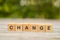 Wooden cube with word `change` on blurred background, Personal development and career growth or change yourself concepts.