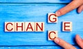 Wooden cube with word `change` to `chance` on wood table. Personal development and career growth or change yourself concept. conce Royalty Free Stock Photo