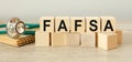 Wooden cubes with the abbreviation FAFSA