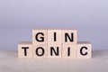 wooden cubes building the word Gin Tonic, white background