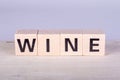 wooden cubes building the word Wine, white background Royalty Free Stock Photo