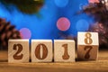 Wooden cubes 2018. Cometh the new year. Blurred background. A place for a label. With the New year. Royalty Free Stock Photo