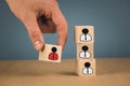 wooden cubes in the form of bosses and subordinates, personnel subordination on a blue background