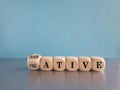 Wooden cubes form the words innovative and creative. Beautiful grey table blue background. Copy space. Symbol for being innovative