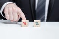 Wooden cubes with green and red percent signs, business percentage banks mortgage concept Royalty Free Stock Photo