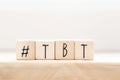 Wooden cubes with Hashtag tbt, meaning Throwback Thursday near white background social media concept