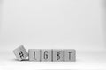 Wooden cubes with a Hashtag and the word LGBT isolated on white, lesbien,gay,bisexual,transgender and social media