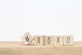 Wooden cubes with hashtag and XOXO hugs and kisses letters of love near white background, social media concept