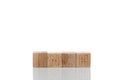 Wooden cubes with letters inch on a white background