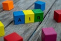 colored wooden cubes with letters. the word air is displayed, abstract illustration Royalty Free Stock Photo