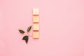 Wooden cubes lie in a row on pink background. The concept of using environmentally friendly natural materials Zero West.