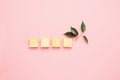 Wooden cubes lie in a row on pink background. The concept of using environmentally friendly natural materials Zero West.