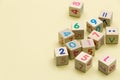 Wooden cubes with numbers on light green background