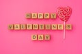 Wooden cubes with the phrase Happy Valentine`s Day on an empty colorful pink background. Words of love are made of letters from Royalty Free Stock Photo