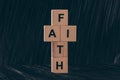 wooden cubes in shape of cross with word Faith Royalty Free Stock Photo