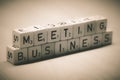 Wooden cubes showing the word business meeting on a table Royalty Free Stock Photo