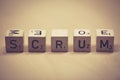 Wooden cubes showing the word scrum on a table Royalty Free Stock Photo