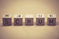 Wooden cubes showing the word scrum on a table Royalty Free Stock Photo