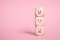 Wooden Cubes smilies faces symbols on Pink, Customer experience rating