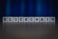 Wooden cubes on a table showing the word BLOCKCHAINmacro shot of