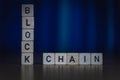 Wooden cubes on a table showing the word BLOCKCHAINmacro shot of