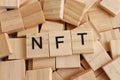 Wooden cubes with the text NFT Ã¢â¬â non fungible token