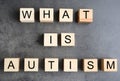 Wooden cubes with text WHAT IS AUTISM