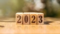 Wooden cubes with text 2023 written in black on a wooden block surface. Happy New Year concept Royalty Free Stock Photo