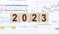 Wooden cubes with text 2023 written on a wooden blocks. Happy New Year concept for business Royalty Free Stock Photo