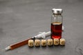 Wooden cubes with word Doping, syringe and vial on black table