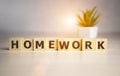 Wooden cubes with word Homework on office table