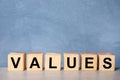 Wooden cubes with word VALUES on light table Royalty Free Stock Photo