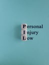 Wooden cubes with words Personal Injury Law. Beautiful blue background. Royalty Free Stock Photo