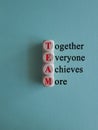 Wooden cubes with words \'TEAM, together everyone achieves more\'. Royalty Free Stock Photo