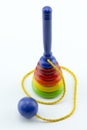 Wooden Cup-and-ball ball in cup toy. Children`s wooden toy to catch the ball. Royalty Free Stock Photo